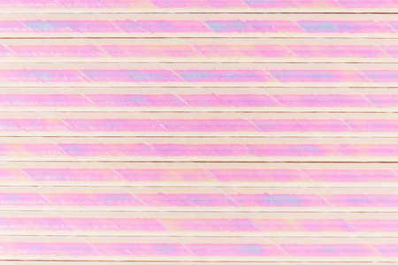 Bright pink holographic foil background Multicolor shiny backgroundの写真素材