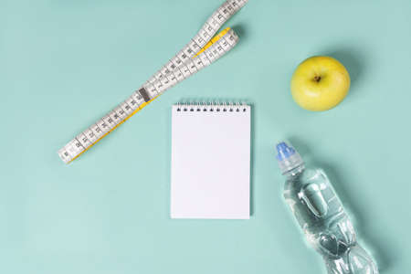 Fitness background. Healthy lifestyle, food, sport on a light background. The apartment was lying. Top view with copy space.の写真素材