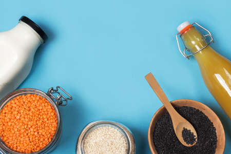 Zero waste storage concept. Healthy cooking, clean food. Assorted sesame seeds and orange cilantro...