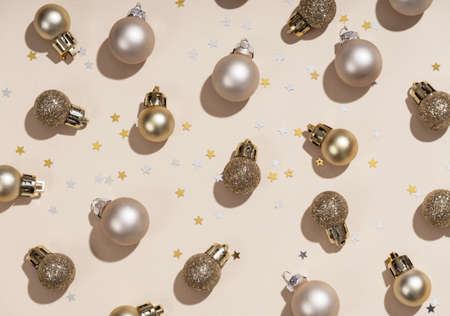 Golden stylish christmas decorations and golden stars, festive pattern. Festive concept.の写真素材