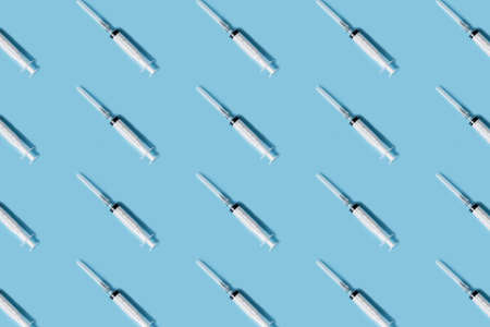 Syringe with medicinal vaccine.Medical background as pattern. Flat lay styleの写真素材