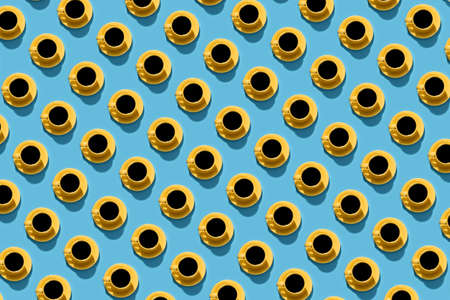 Pattern of a yellow coffee cup on a blue background. Flat style.の写真素材