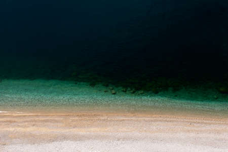 Sandy beach and beautiful azure bay. The view from the top to the sandy beach and the ocean.の写真素材