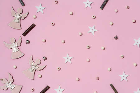 Background of colorful Christmas decor on a pink background. Shiny balls and a Christmas tree on a pink background.の写真素材
