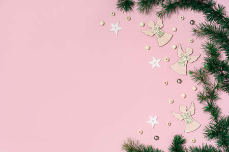 Background of colorful Christmas decor on a pink background. Shiny balls and a Christmas tree on a pink background.の写真素材
