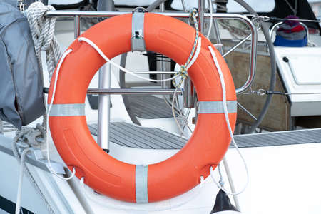 Orange life buoy attached to yacht. water rescue equipmentの写真素材