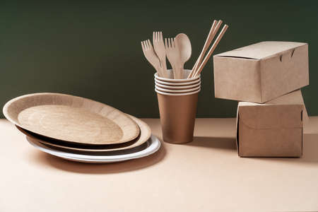 Eco-friendly kraft paper tableware. Dishes, paper cups, fast food containers and cutlery. Recycling or environmentally friendly concept. Zero waste concept.の写真素材