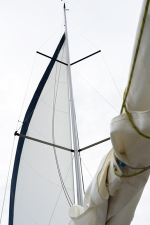 Yacht sails on a sunny summer day. View of the deck mast and sailsの写真素材