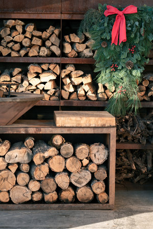 Shelves with neatly stacked chopped firewood. Preparing firewood for the winter. energy crisisの写真素材