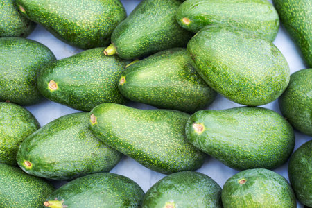 Lots of fresh ripe organic avocados at the farmer's market