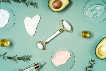 Cosmetic background, facial rollers, anti-aging scraper guashae aroma oil eucalyptus and avocado. skincare setの写真素材