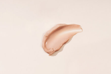 Cosmetic smears of creamy texture on a pastel beige background. Cosmetic background cream care productの写真素材