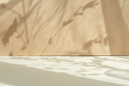 Tropical leaf shadow blank background composition for product presentation. The background is beige....
