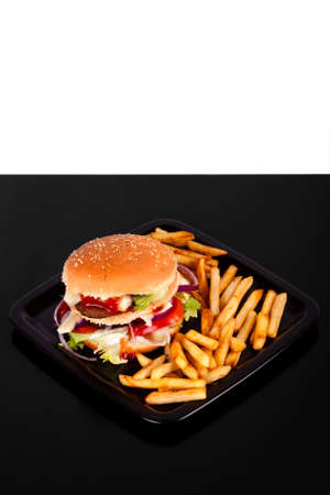 Hamburger with fries isolated on black and white backgroundの写真素材