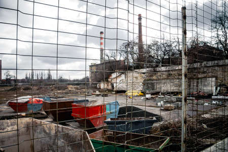 Industrial waste dump outdoors protected with fence