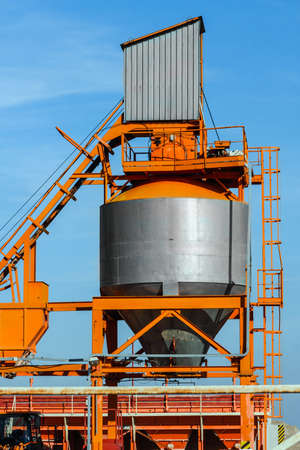 Cement silo against blue skyの写真素材
