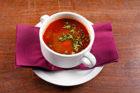 Delicious soup in white dish closeup photoの写真素材