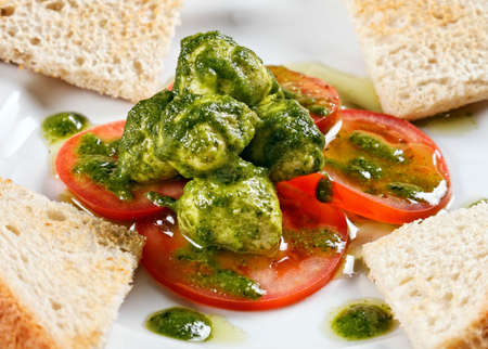 Healthy appetizer with  toast and gnocci on the tableの写真素材