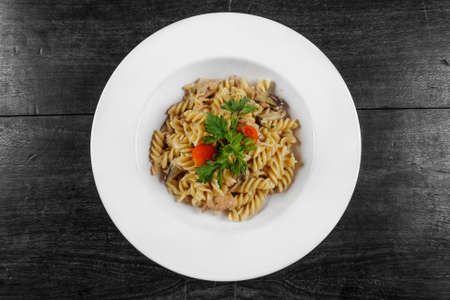 Delicious pasta on white plate closeup photoの写真素材