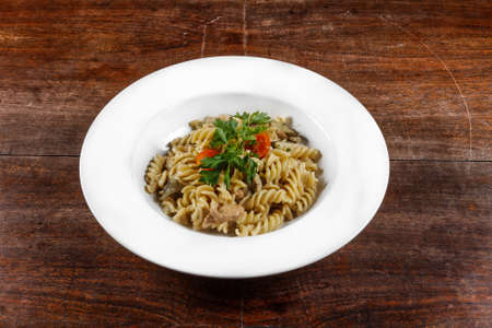 Delicious pasta on white plate closeup photoの写真素材