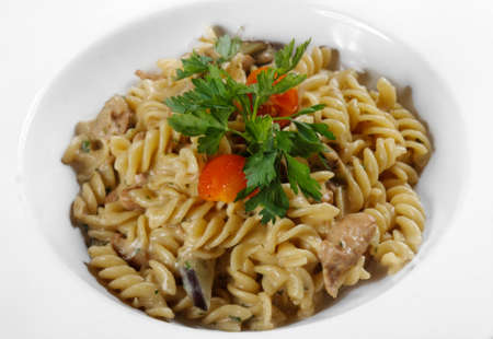 Delicious pasta on white plate closeup photoの写真素材