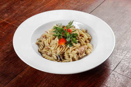Delicious pasta on white plate closeup photoの写真素材