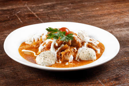 Delicious stew on the wooden tableの写真素材