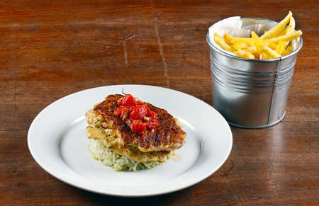 Fried chicken ribs and rice with tomato sauce closeupの写真素材