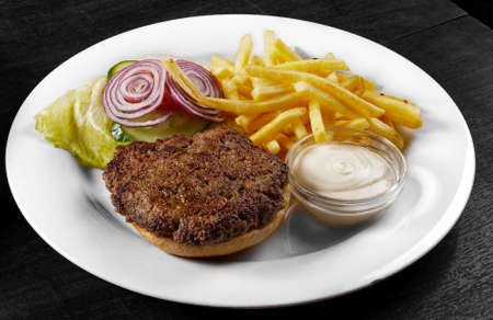 Delicious hamburger on white plate and tableの写真素材