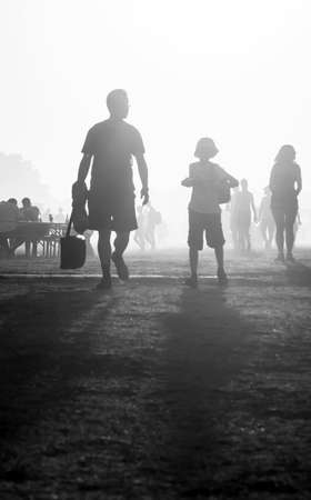 People traveling in the sunset at noon