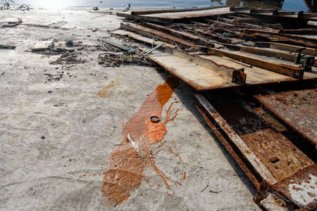 Metal scrap at the shore closeupの写真素材