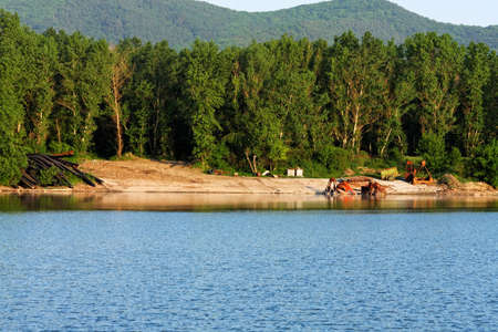 Pipes on the shore of the water outdoorsの写真素材