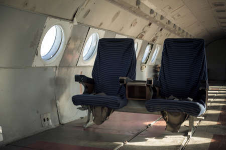 Abandoned airplane interior with seatsの写真素材