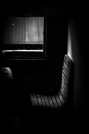 Wooden chair of a train with sunlightの写真素材