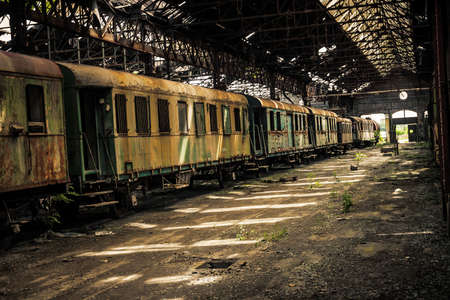 Some trains at abandoned train depotの写真素材