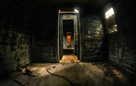 Old train carriage interior with light intrudingの写真素材