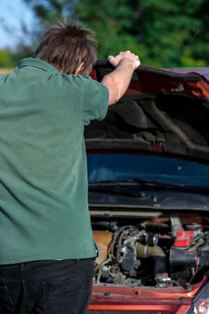 Man repairing motor block of a carの写真素材