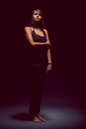 Beautiful woman in the darkの写真素材