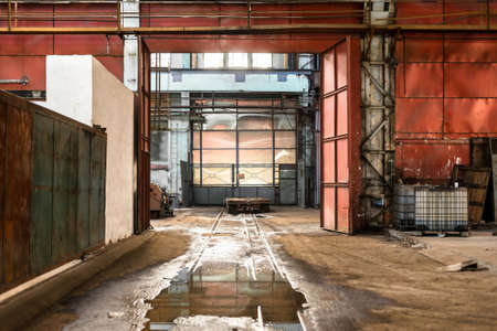 Abandoned industrial interior with doorの写真素材