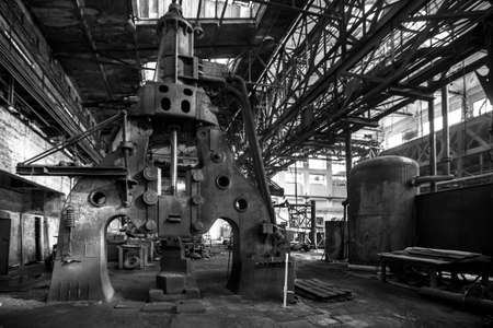 Abandoned industrial interior with hammerの写真素材