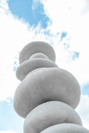 balancing stones against blue skyの写真素材