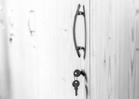 Keys on a row of office cabinets closeupの写真素材