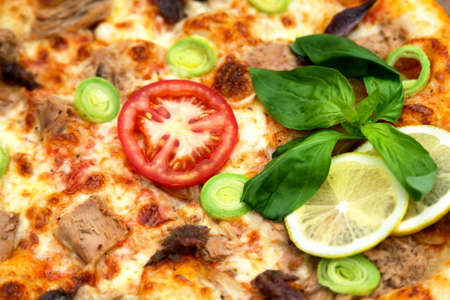 Delicious italian pizza served on wooden tableの写真素材