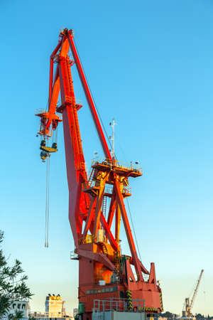 Industrial crane against blue sky