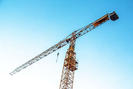 Industrial crane against blue skyの写真素材