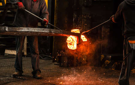 Hot steel ingot in the workspaceの写真素材