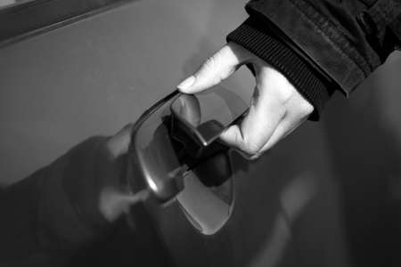 Hand of a man opening car doorの写真素材