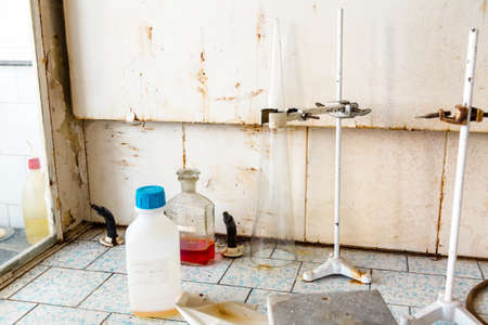 old laboratory with a lot of bottles and dirtの写真素材