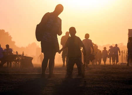 Lots of people in the dust travelingの写真素材