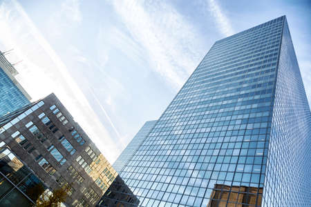 Skyscrapers against blue sky and cloudsの写真素材